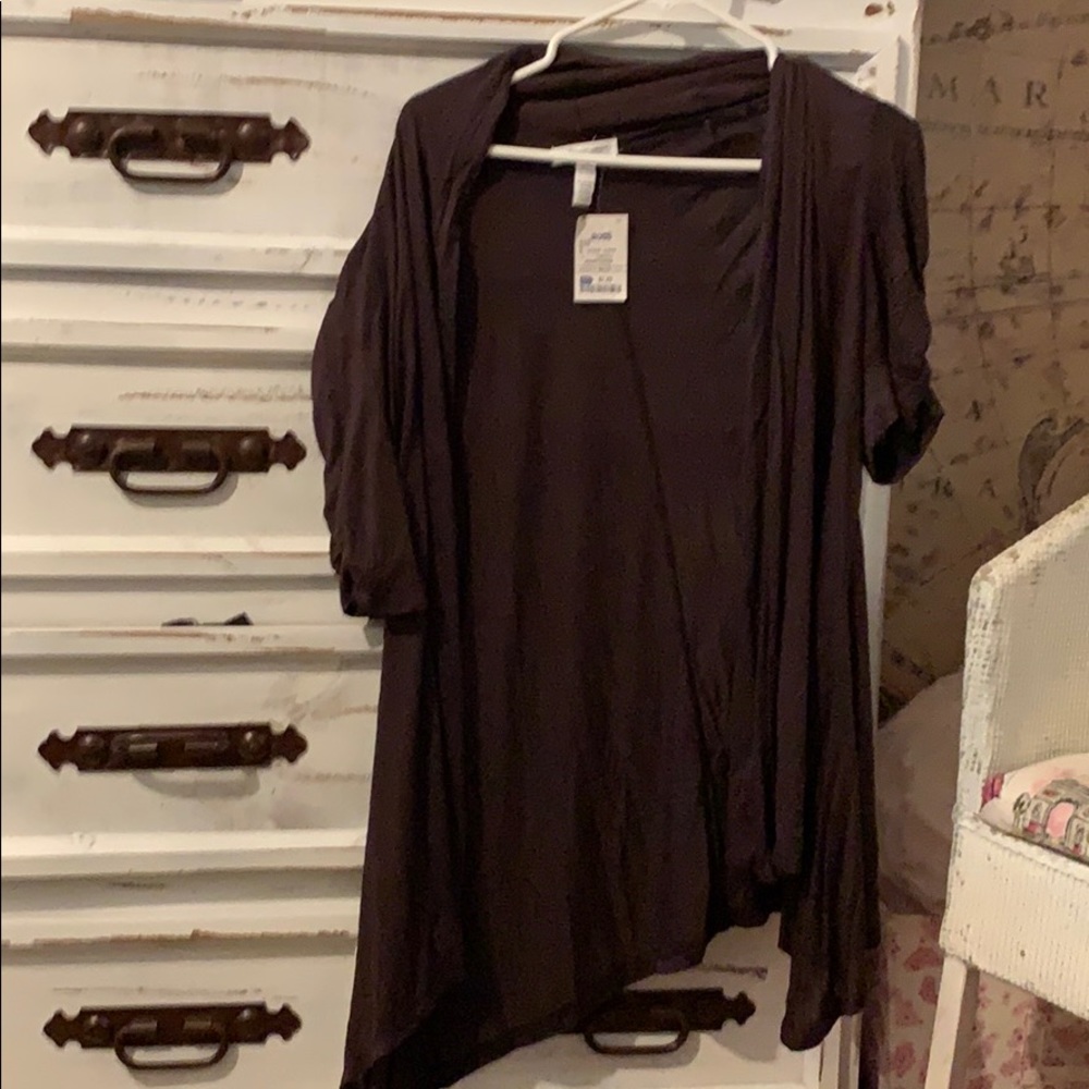 a brown shawl with sleeves